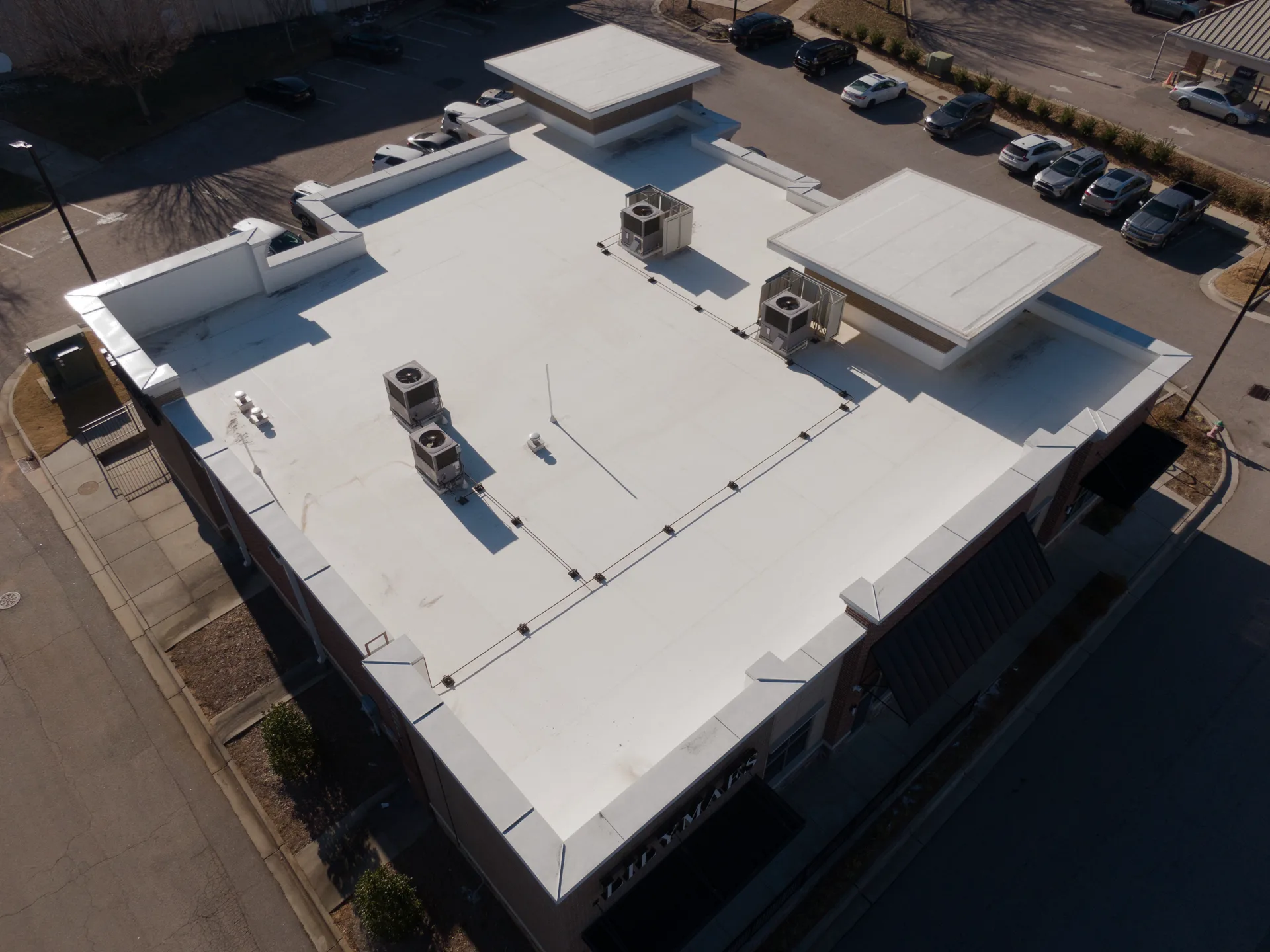 Low-slope flat roof system on a residential property