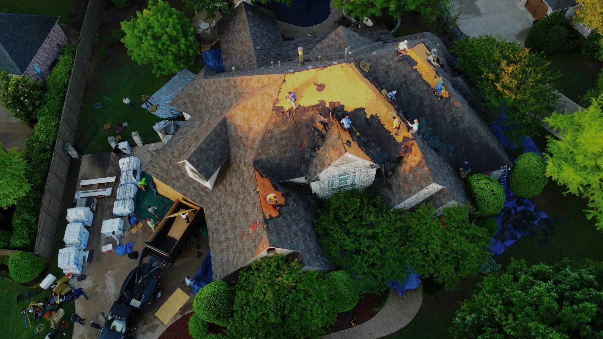 A KD Roofing crew replacing a residential roof in the DFW Metroplex